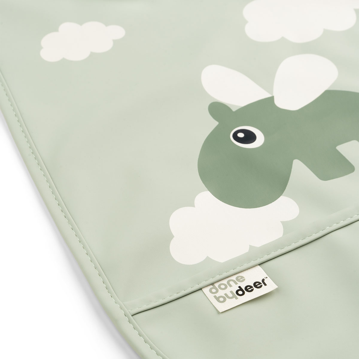 Zoom sur le motif éléphant et nuages du bavoir Done by Deer vert.
