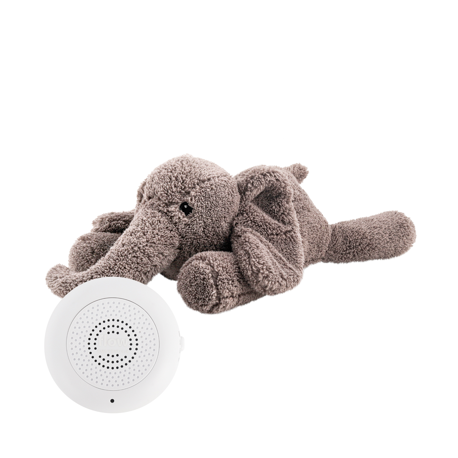 Peluche George l’Éléphant gris Flow Amsterdam vue de profil avec boîtier sonore rechargeable posé devant – montre le système amovible