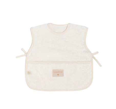 Bavoir tablier bébé Nobodinoz Natural 6-18 mois avec poche récupératrice et fermetures latérales matière éponge de coton bio