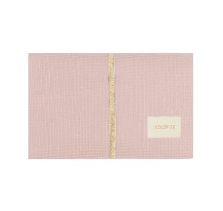 Matelas à langer nomade rose pâle Nobodinoz plié et fermé