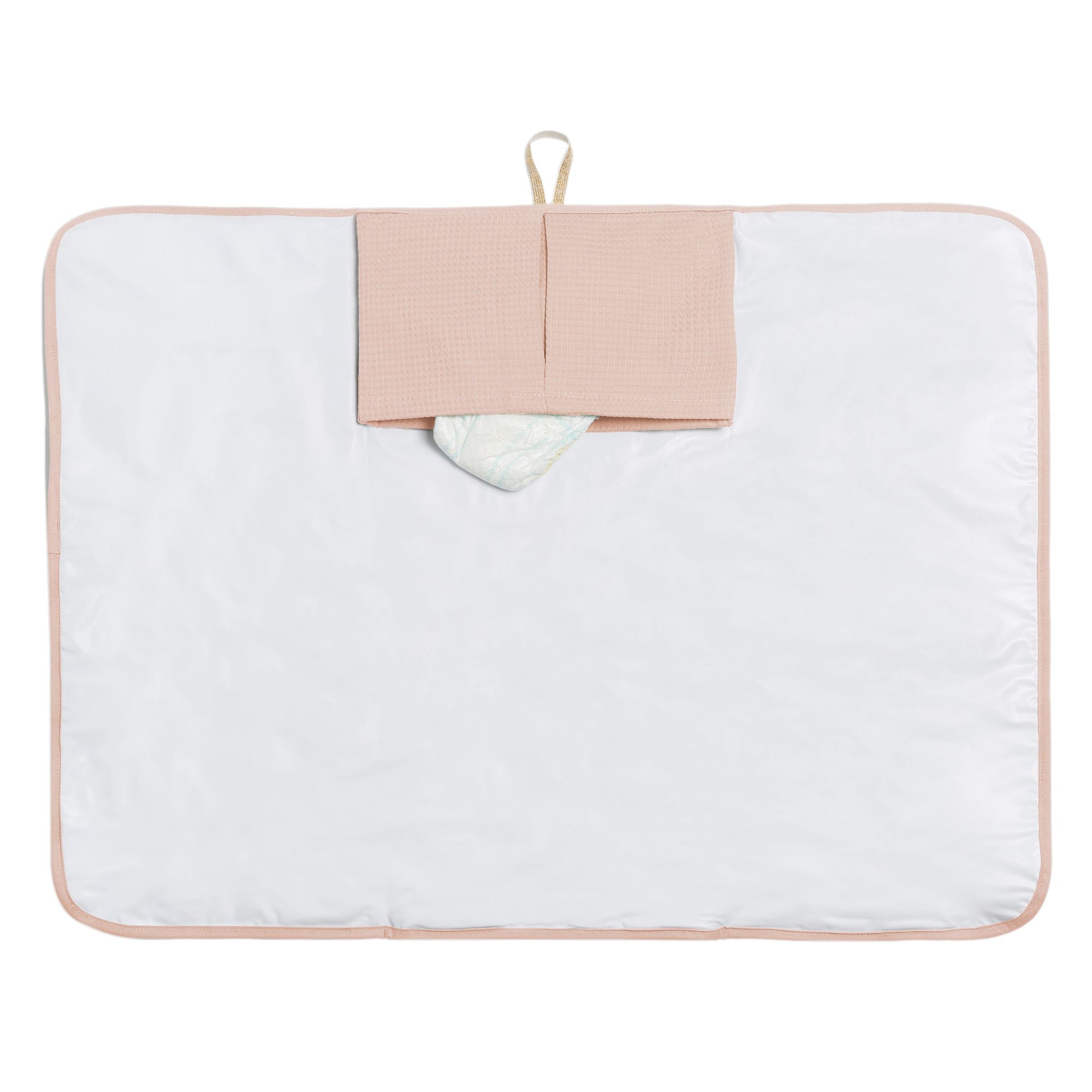 Matelas à langer nomade rose pâle Nobodinoz déplié avec poches intégrées