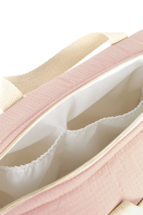 Intérieur du sac à langer rose pâle Nobodinoz Gala avec doublure waterproof et poches