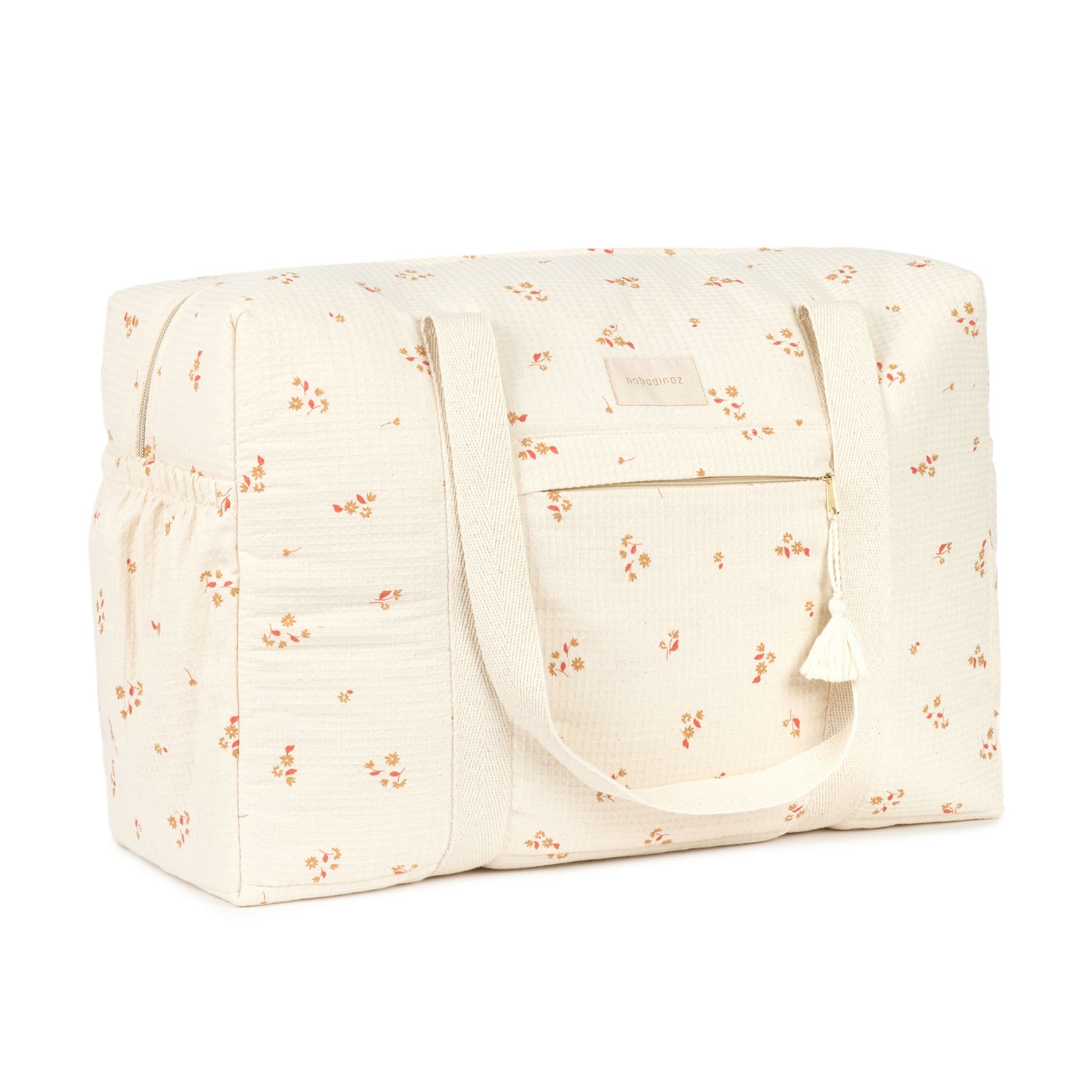 Sac à langer Nobodinoz Opera yellow lily vu de côté, en coton bio imperméable