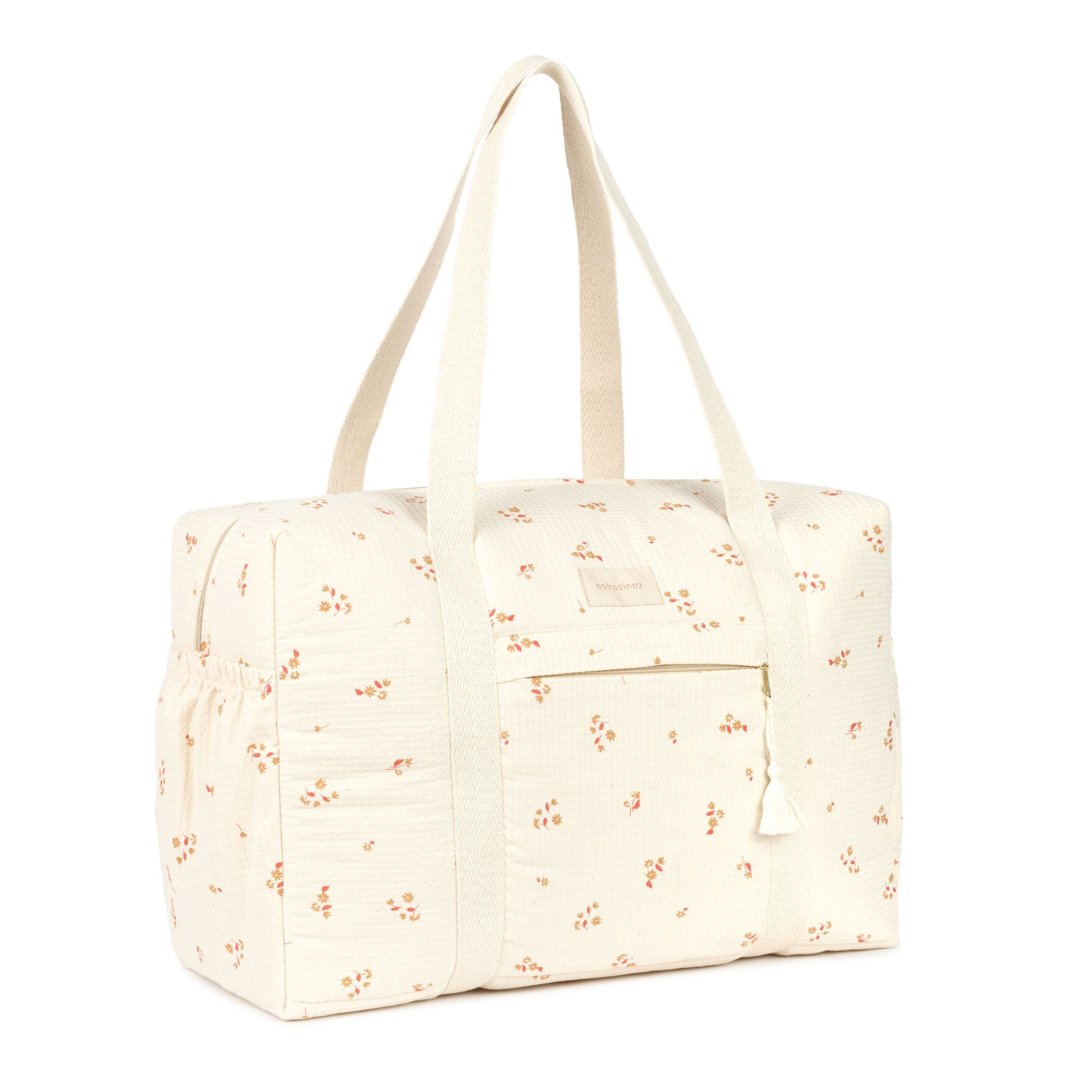 Sac à langer Nobodinoz Opera yellow lily vu de trois quarts avec anses longues en coton bio